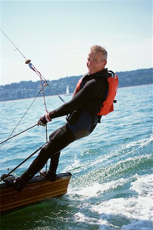 simsearch:600-01464328,k - Man on Sailboat Stock Photo - Rights-Managed, Code: 700-00378311