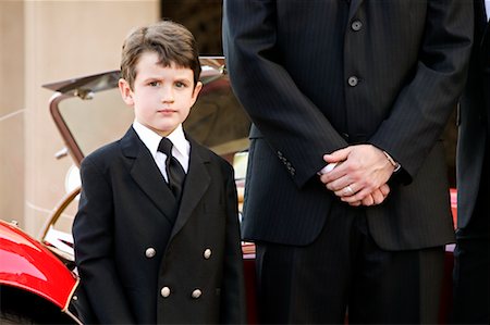 simsearch:614-03469507,k - Portrait of Boy with Chauffeur Fotografie stock - Rights-Managed, Codice: 700-00371264