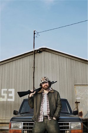 redneck facial hair - Portrait of Man with Shotgun Stock Photo - Rights-Managed, Code: 700-00404156