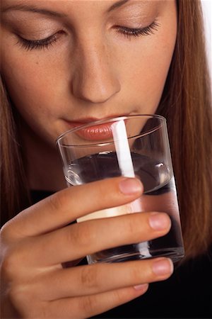 satisfied (thirst) - Woman Drinking Water Foto de stock - Con derechos protegidos, Código: 700-00403878