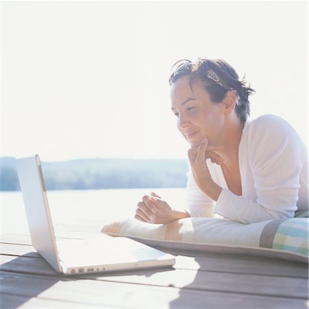 female dock workers - Woman Using Laptop Stock Photo - Rights-Managed, Code: 700-00424457