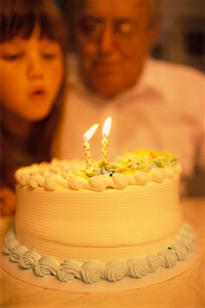 simsearch:700-00064984,k - Granddaughter Blowing out Birthday Candles Fotografie stock - Rights-Managed, Codice: 700-00424492