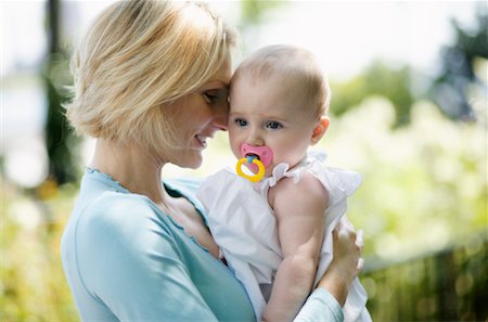 pacifier mom holding - Mother with Baby Stock Photo - Rights-Managed, Code: 700-00424545