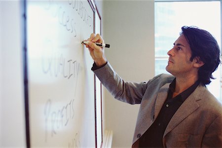 Businessman Writing on Whiteboard Stock Photo - Rights-Managed, Code: 700-00424993