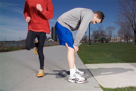 Man Resting While Other Man is Jogging Stock Photo - Rights-Managed, Code: 700-00425479