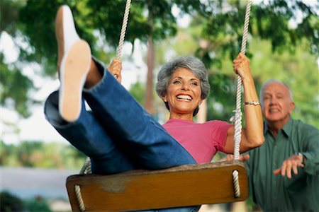 Couple Playing on Tree Swing Stock Photo - Rights-Managed, Code: 700-00425687