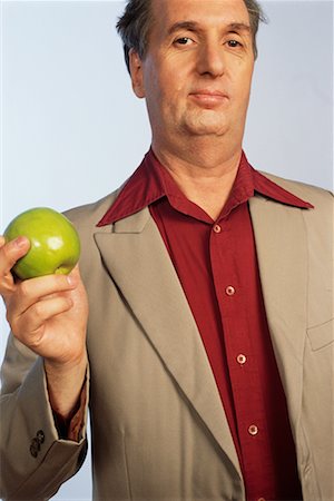 Man Holding Apple Foto de stock - Con derechos protegidos, Código: 700-00425745