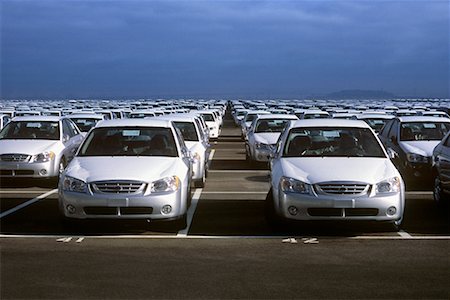 New Car Lot with Storm Clouds Stock Photo - Rights-Managed, Code: 700-00425809