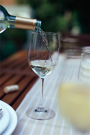 restaurant table food not people not overhead - Bottle Filling Wine Glass Stock Photo - Rights-Managed, Code: 700-00426103