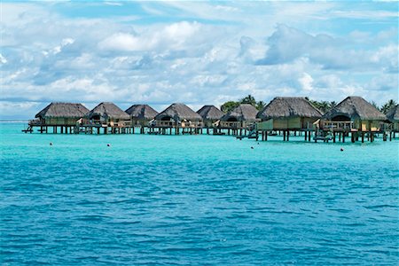 Bungalows at Bora Bora Pearl Beach Resort, Bora Bora, French Polynesia Stock Photo - Rights-Managed, Code: 700-00426279