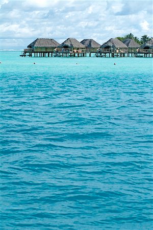 Bungalows at Bora Bora Pearl Beach Resort, Bora Bora, French Polynesia Stock Photo - Rights-Managed, Code: 700-00426281