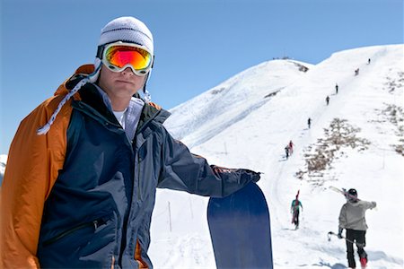 Portrait of Snowboarder Standing by Hill Stock Photo - Rights-Managed, Code: 700-00429858