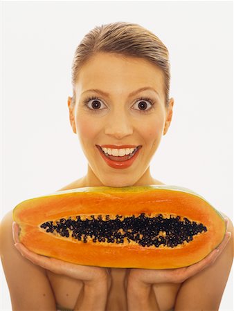 passion fruit - Portrait de femme tenant la papaye Photographie de stock - Rights-Managed, Code: 700-00439057