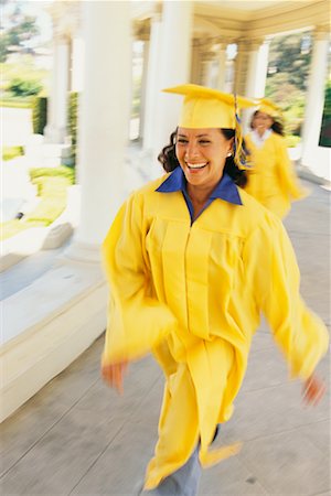 student walking in graduation gown image - Mature Student Graduating Stock Photo - Rights-Managed, Code: 700-00439914