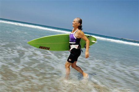 simsearch:700-00439937,k - Woman Surfing Foto de stock - Direito Controlado, Número: 700-00439945