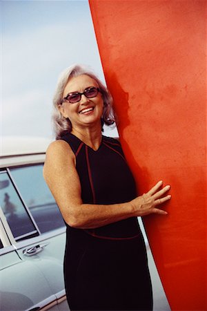 photos of old woman with surfboard - Portrait of Woman with Surfboard Stock Photo - Rights-Managed, Code: 700-00439943