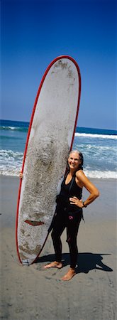 simsearch:700-00439937,k - Woman Holding Surfboard Foto de stock - Direito Controlado, Número: 700-00439952