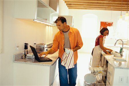 Couple Doing Chores Foto de stock - Direito Controlado, Número: 700-00439968
