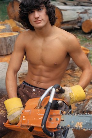 Man Using Chainsaw Foto de stock - Con derechos protegidos, Código: 700-00430158