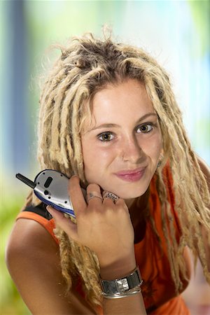 dreads teen - Girl Holding Mobile Phone Stock Photo - Rights-Managed, Code: 700-00430314