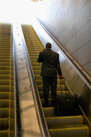 Man on Escalator, Boston, Massachusetts, USA Foto de stock - Con derechos protegidos, Código: 700-00430716