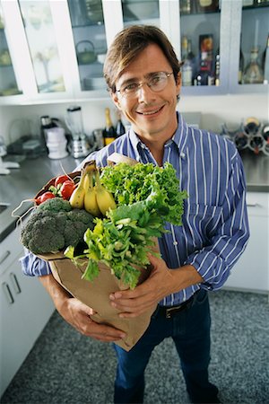 simsearch:700-00350275,k - Man with Bag of Groceries in Kitchen Stock Photo - Rights-Managed, Code: 700-00440082