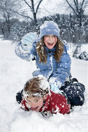 preteen girls tongue - Two Girls Playing in the Snow Stock Photo - Rights-Managed, Code: 700-00458157