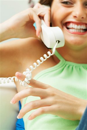 Young Woman Using Telephone Stock Photo - Rights-Managed, Code: 700-00458180