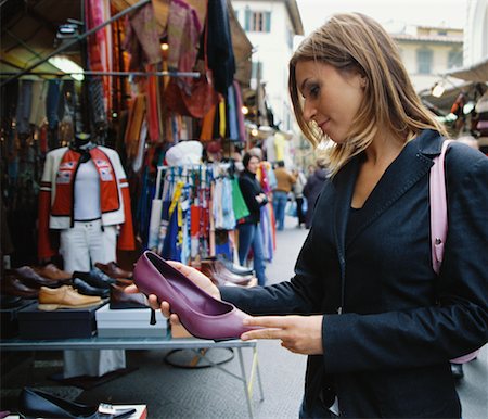 simsearch:700-00768322,k - Woman Looking at Shoe in Market Stock Photo - Rights-Managed, Code: 700-00458293