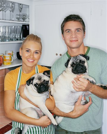 dogs and woman in kitchen - Portrait of Couple Holding Dogs Stock Photo - Rights-Managed, Code: 700-00452736
