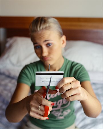 shopaholic bedroom - Woman Cutting Up Credit Card Stock Photo - Rights-Managed, Code: 700-00452746