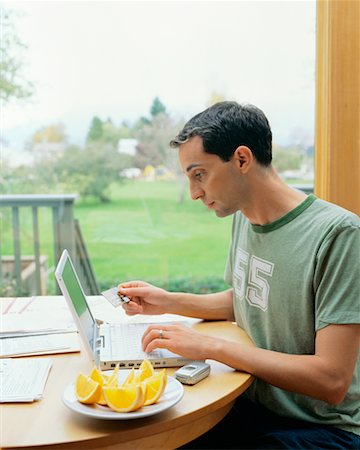 Man Using Laptop Computer Stock Photo - Rights-Managed, Code: 700-00452928