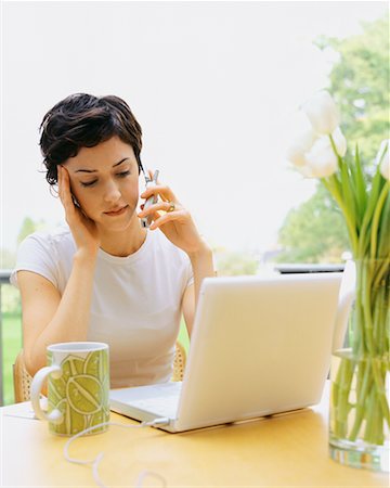 simsearch:700-00280412,k - Woman Using Cellphone and Laptop Computer Stock Photo - Rights-Managed, Code: 700-00452938