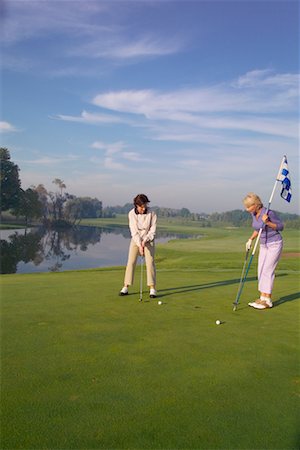 simsearch:700-00453090,k - Women Golfing Fotografie stock - Rights-Managed, Codice: 700-00452942