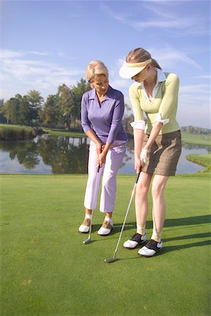 picture of mom and daughter playing golf - Mother and Daughter Golfing Stock Photo - Rights-Managed, Code: 700-00453043