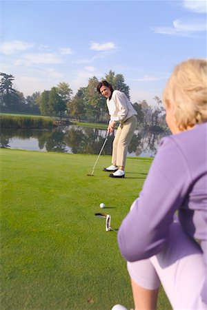 simsearch:700-00453090,k - Women Golfing Fotografie stock - Rights-Managed, Codice: 700-00453088