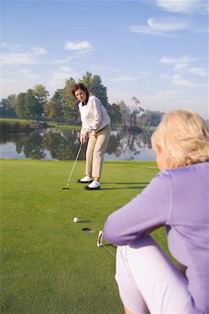 simsearch:700-00453090,k - Women Golfing Fotografie stock - Rights-Managed, Codice: 700-00453089