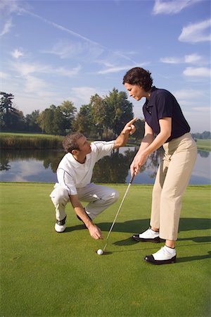 female golfers putting stances - Man Teaching Woman To Putt Stock Photo - Rights-Managed, Code: 700-00453096