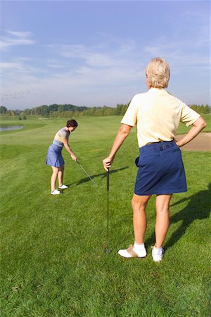 simsearch:700-00453090,k - Two Women Playing Golf Fotografie stock - Rights-Managed, Codice: 700-00453114
