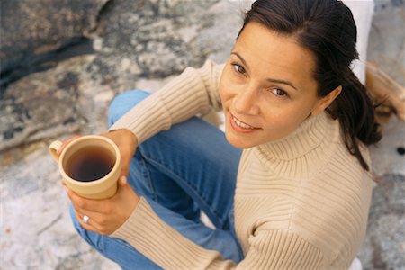 Woman Sitting on Log with Coffee Stock Photo - Rights-Managed, Code: 700-00453566