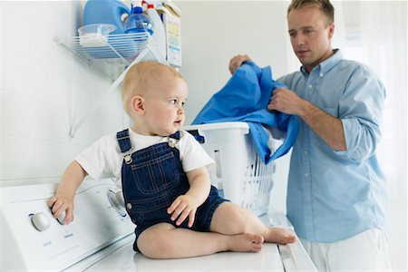 father and son overalls - Father in Laundry Room with Baby Stock Photo - Rights-Managed, Code: 700-00476748