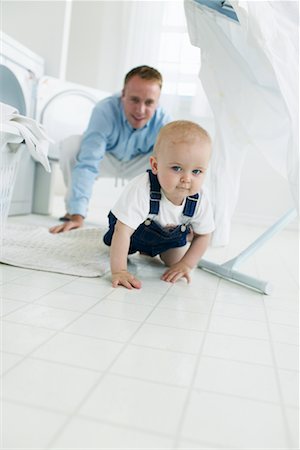 father and son overalls - Father and Son in Laundry Room Stock Photo - Rights-Managed, Code: 700-00476757