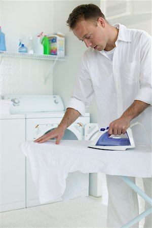 simsearch:700-02912544,k - Man Ironing Stock Photo - Rights-Managed, Code: 700-00476772
