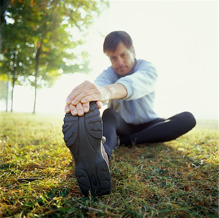 foreshortened grass - Jogger Stretching Stock Photo - Rights-Managed, Code: 700-00476843