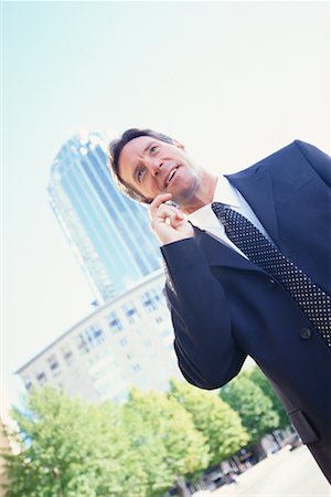 simsearch:700-00043555,k - Businessman Using Cellular Phone Stock Photo - Rights-Managed, Code: 700-00477164