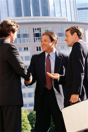 simsearch:700-00611230,k - Businessmen Shaking Hands Outdoors Stock Photo - Rights-Managed, Code: 700-00477160