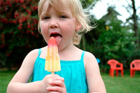 Girl Eating Popsicle Stock Photo - Rights-Managed, Code: 700-00477212