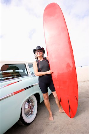 surfers and middle age and car - Portrait of Woman with Surfboard By Car Stock Photo - Rights-Managed, Code: 700-00477298