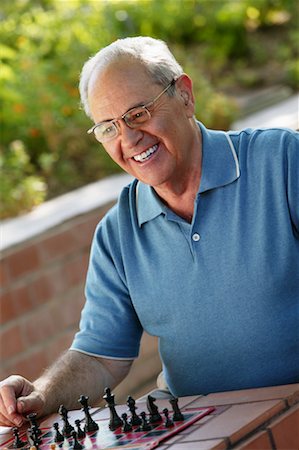 Man Playing Chess Stock Photo - Rights-Managed, Code: 700-00477890