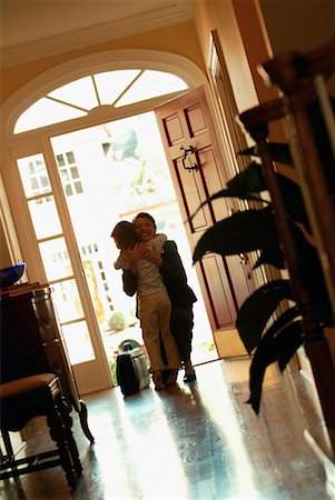 Daughter Greeting Mother at Door Foto de stock - Con derechos protegidos, Código: 700-00478021
